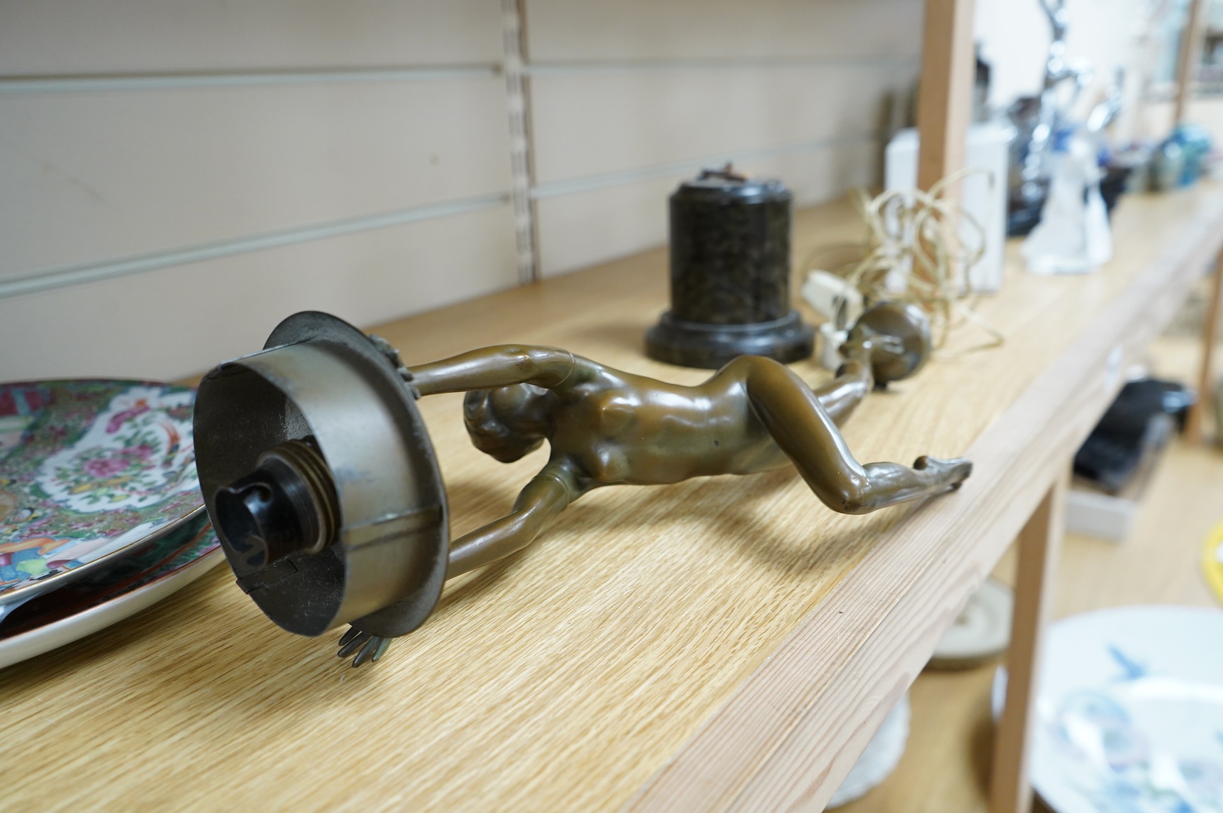 An Art Deco patinated spelter figural lamp, serpentine marble plinth (detached)